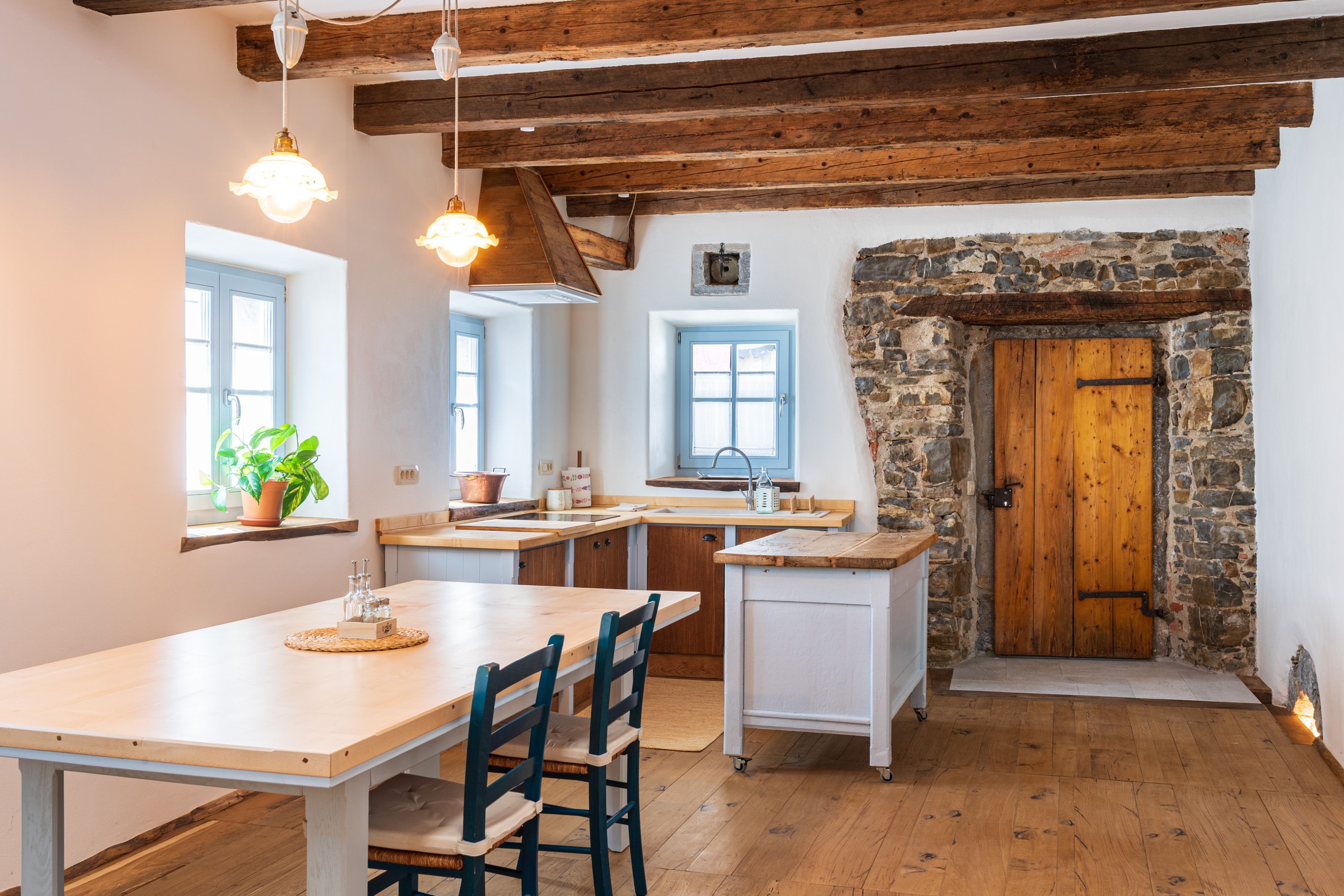 Kitchen with island and stone doorway