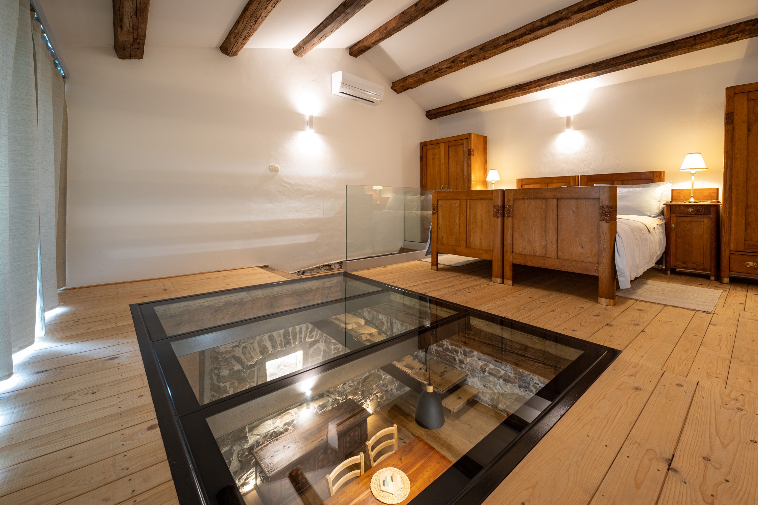 Oak bedroom above the structural glass floor